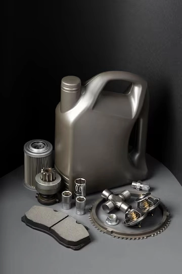 قیمت روغن موتور - تصویر عکاسی شده از یک گالن روغن و تعدادی از قطعات داخلی خودرو